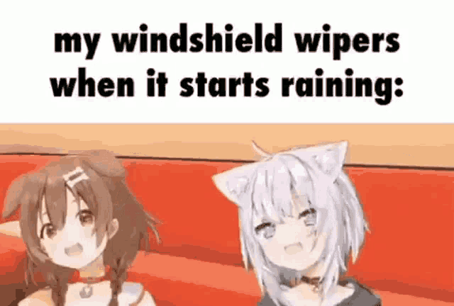 a couple of anime girls are sitting on a couch .