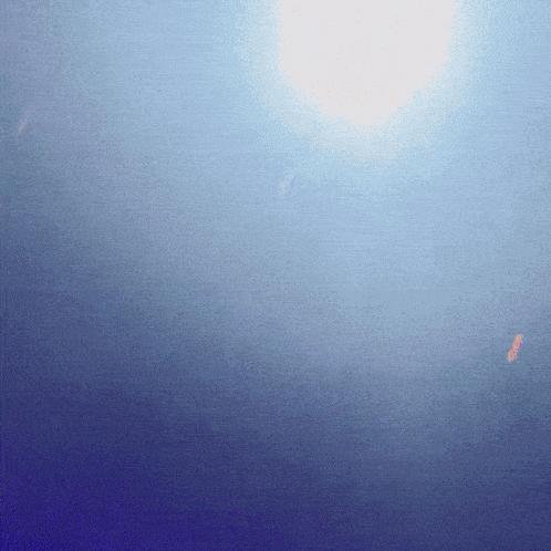a blue background with the sun shining through