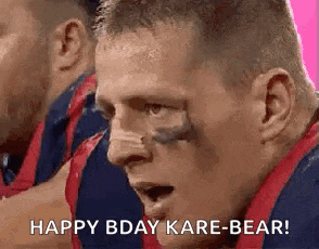 a close up of a man 's face with the words `` happy bday kare-bear '' .