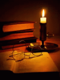 Candle Reading GIF - Candle Reading Candle Light GIFs