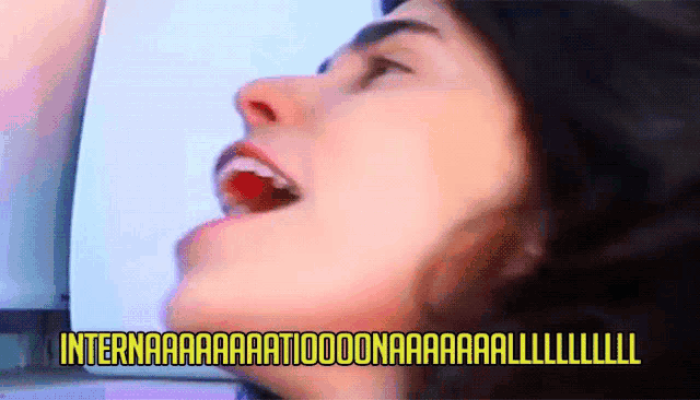 a close up of a woman 's face with the words " internaaaa " written above her