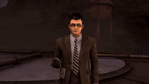a man in a suit and tie is holding a badge that says id