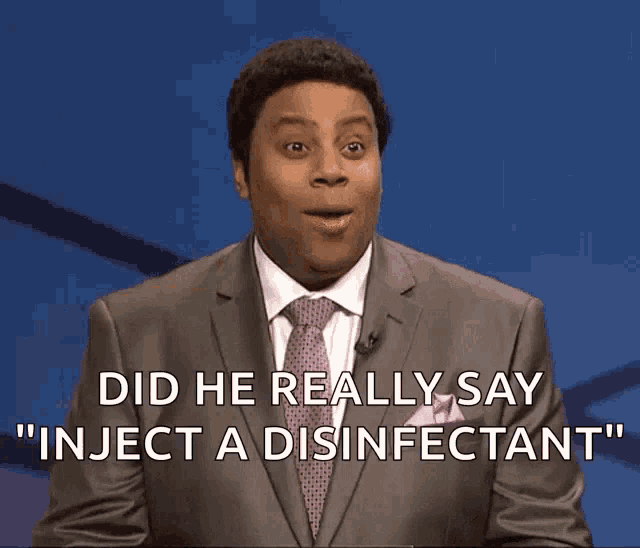 a man in a suit and tie says " did he really say inject a disinfectant " in front of a blue background