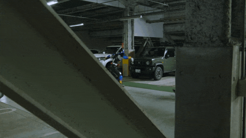a group of people standing in a parking garage