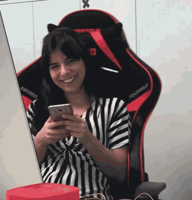 a woman sits in a chair that says yourself