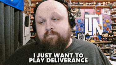 a bald man with a beard is wearing headphones and says " i just want to play deliverance "