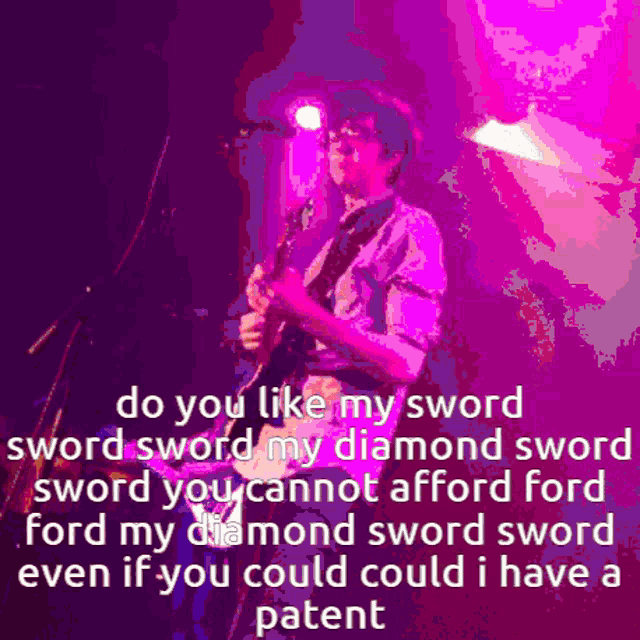 a man is playing a guitar on stage with a purple background