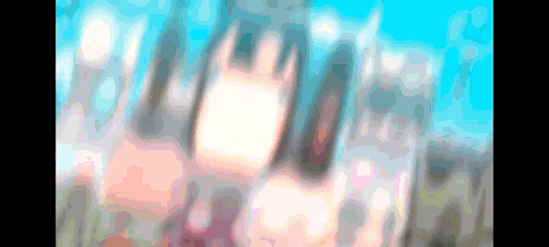 a blurry picture of a person 's face with a blue sky behind them