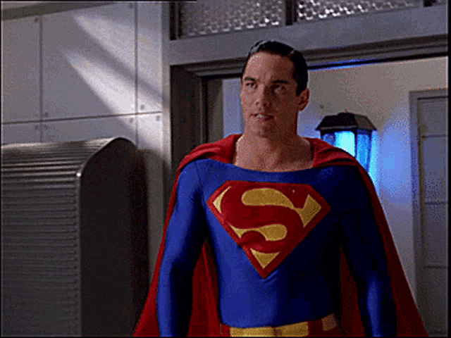 a man in a blue and red superman costume