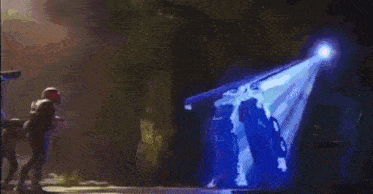 a close up of a robot 's face with glowing blue eyes
