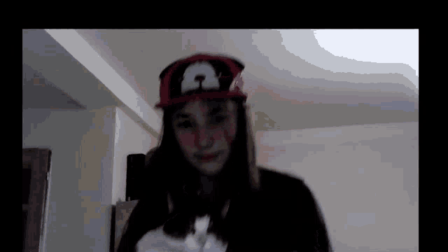 a girl wearing a hat with a dog on it