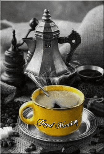 a black and white photo of a cup of coffee with the words good morning written on it