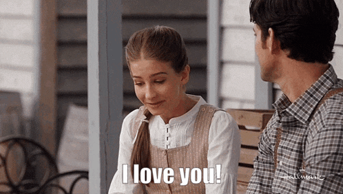 a man and a woman are sitting on a porch and the woman is saying i love you .