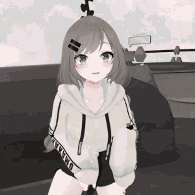 a girl wearing a hoodie that says omaha on the sleeves