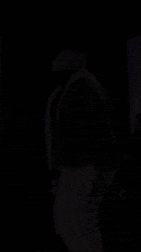 a man with a beard is holding a microphone in his hand