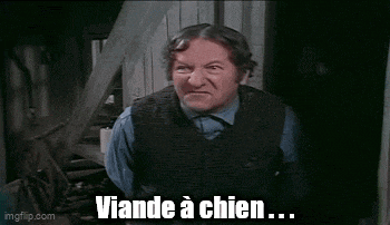 a man is making a funny face with the words `` un vrai scandale '' written below him .