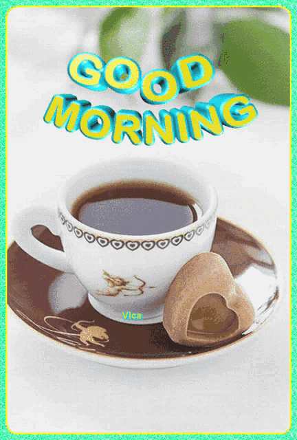 a cup of coffee and a cookie on a saucer with the words good morning above it