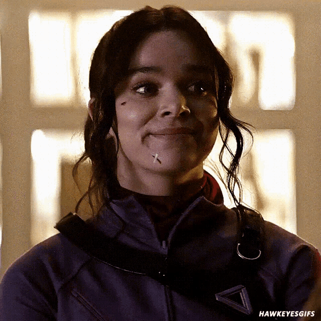 a close up of a woman 's face with the words hawkeye gifs on the bottom right