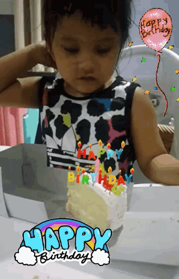 a little girl wearing a cow print shirt looks at a birthday cake