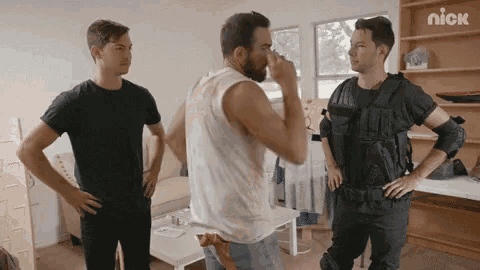 three men are standing in a living room with nick written on the bottom