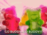a group of gummy bears standing next to each other with the words `` go buddy go buddy ''