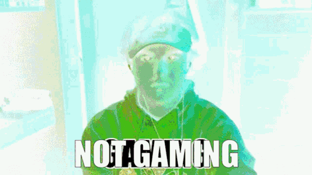 a man in a green hoodie with the words not a gaming on the bottom