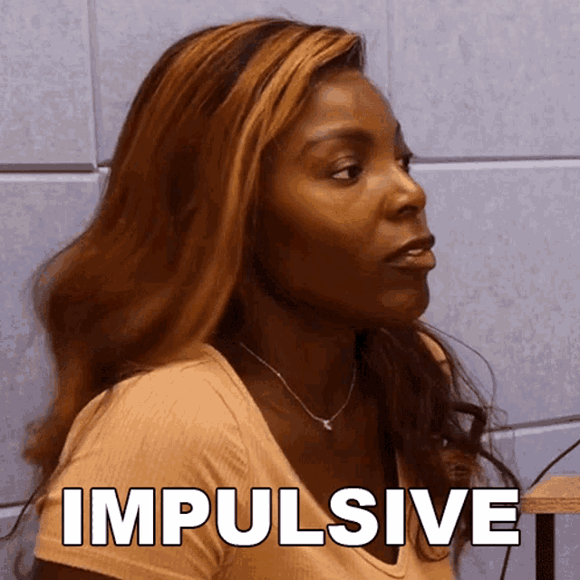 a woman with a necklace and a shirt that says impulsive