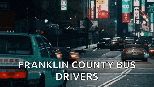 a franklin county bus driver is driving down a city street