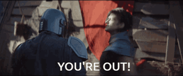 a man and a woman are standing next to each other with the words you 're out in the corner