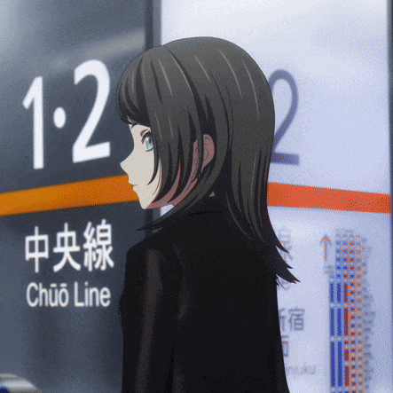 a girl stands in front of a sign for the chuo line