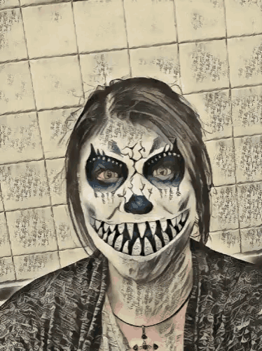 a woman with a face painted like a skeleton