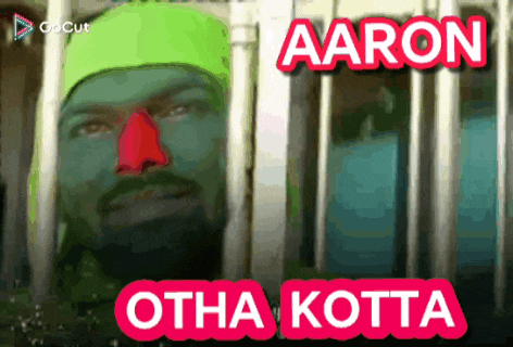 a man with green paint on his face and the name aaron