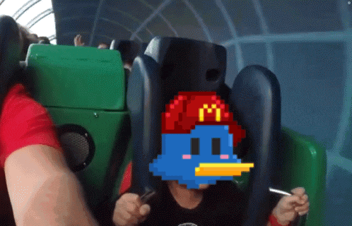 a child wearing a mcdonald 's hat is sitting in a roller coaster