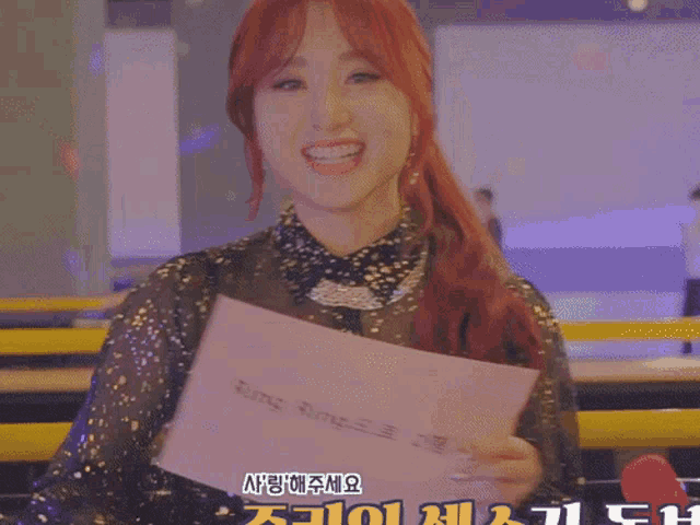 a woman holding a sign that says ring ring on it