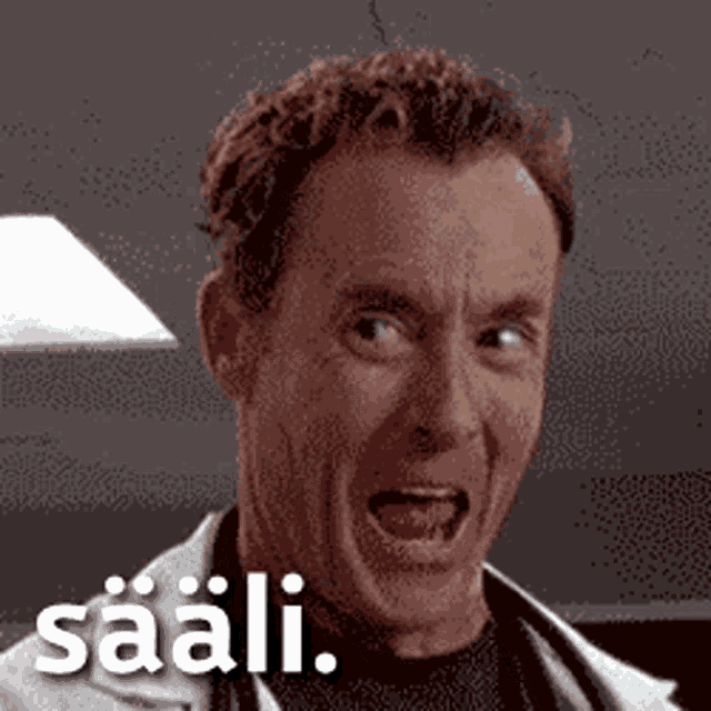 a man is making a funny face with the word saali written on the bottom of his face .