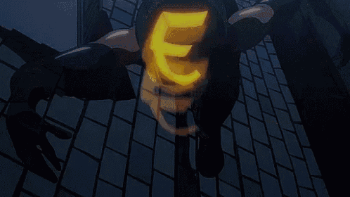 a person is holding a glowing object in their hand in a dark room .