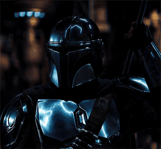 a close up of a man in armor with a helmet on