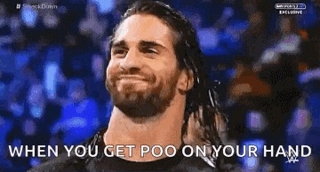 a man with long hair is smiling with the words when you get poo on your hand below him .