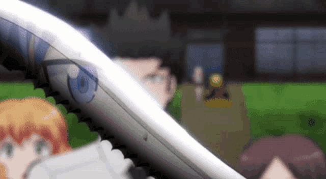 a close up of a person holding a sword in front of a blurry background of people .