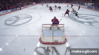a hockey game is being played in a stadium sponsored by t mobile