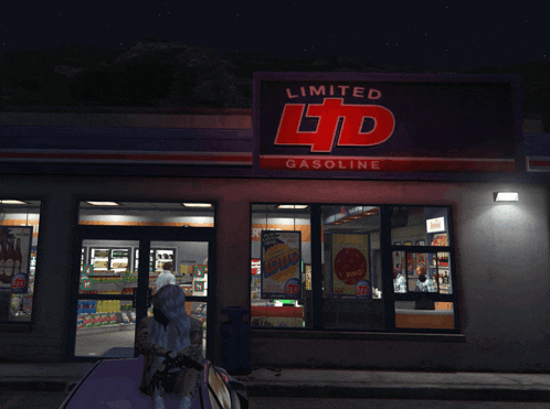 a limited ltd gasoline store with a purple car parked outside