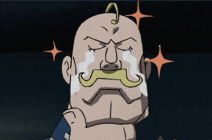 a bald man with a mustache is crying with tears on his face