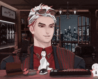 a man in a suit and tie is sitting at a table with a keyboard and a mouse