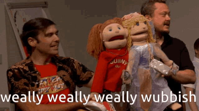a man holding a puppet with the words weally weally weally wubdish written on the bottom