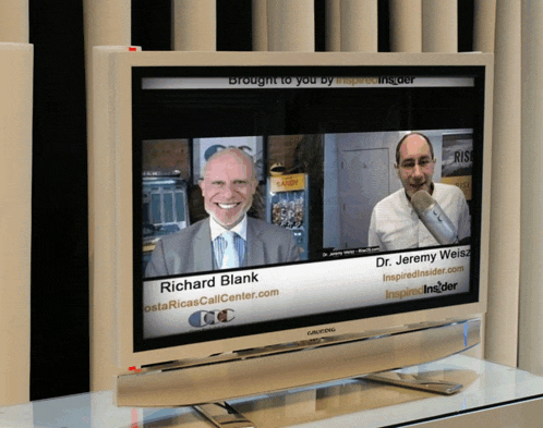 a tv screen shows richard blank talking to dr. jeremy weiss
