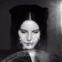 a black and white photo of a woman 's face