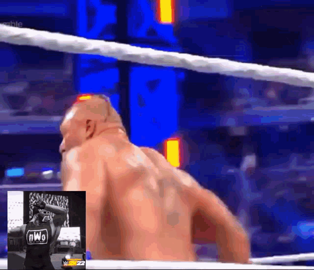 a man in a wrestling ring with a nwo shirt on