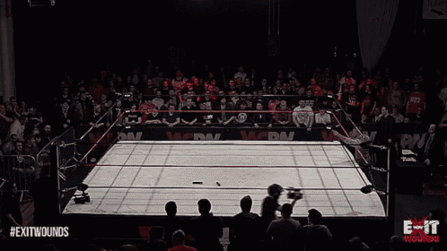 a wrestling ring with the words exit wounds on the bottom