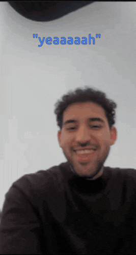 a man with a beard is smiling in front of a white background with the words " yeaaaah " on it