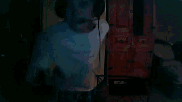 a man wearing a headset is screaming into the camera